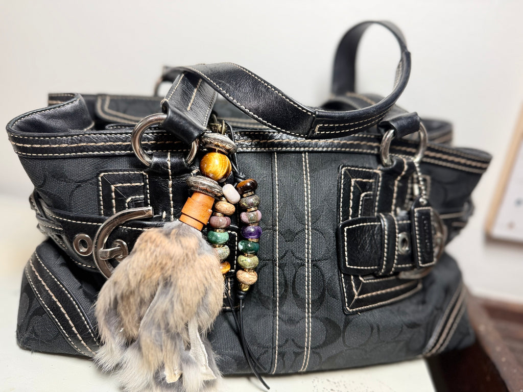 Handcrafted brown fur bag charm with tigers eye semiprecious stones and leather detailing by Chasing Sunsets Design.