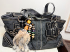 Handcrafted brown fur bag charm with tigers eye semiprecious stones and leather detailing by Chasing Sunsets Design.