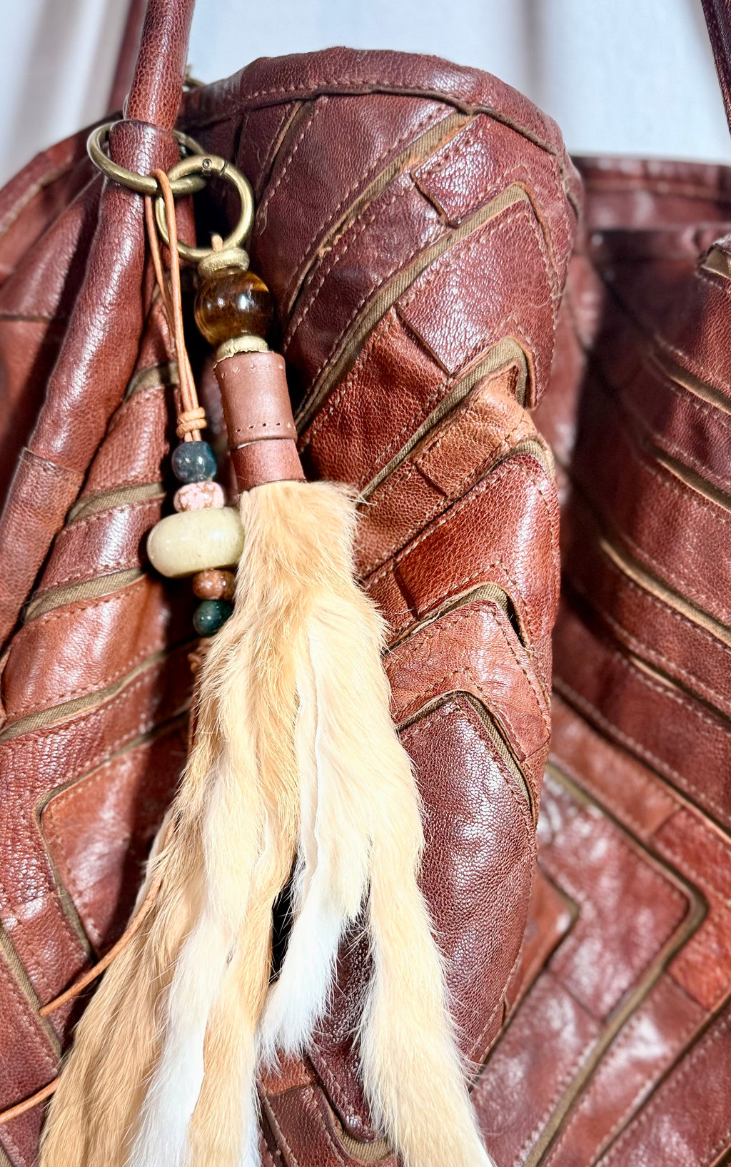 The CURIO Fur Tassel Bag Charm Purse Accessory