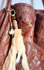 The CURIO Fur Tassel Bag Charm Purse Accessory