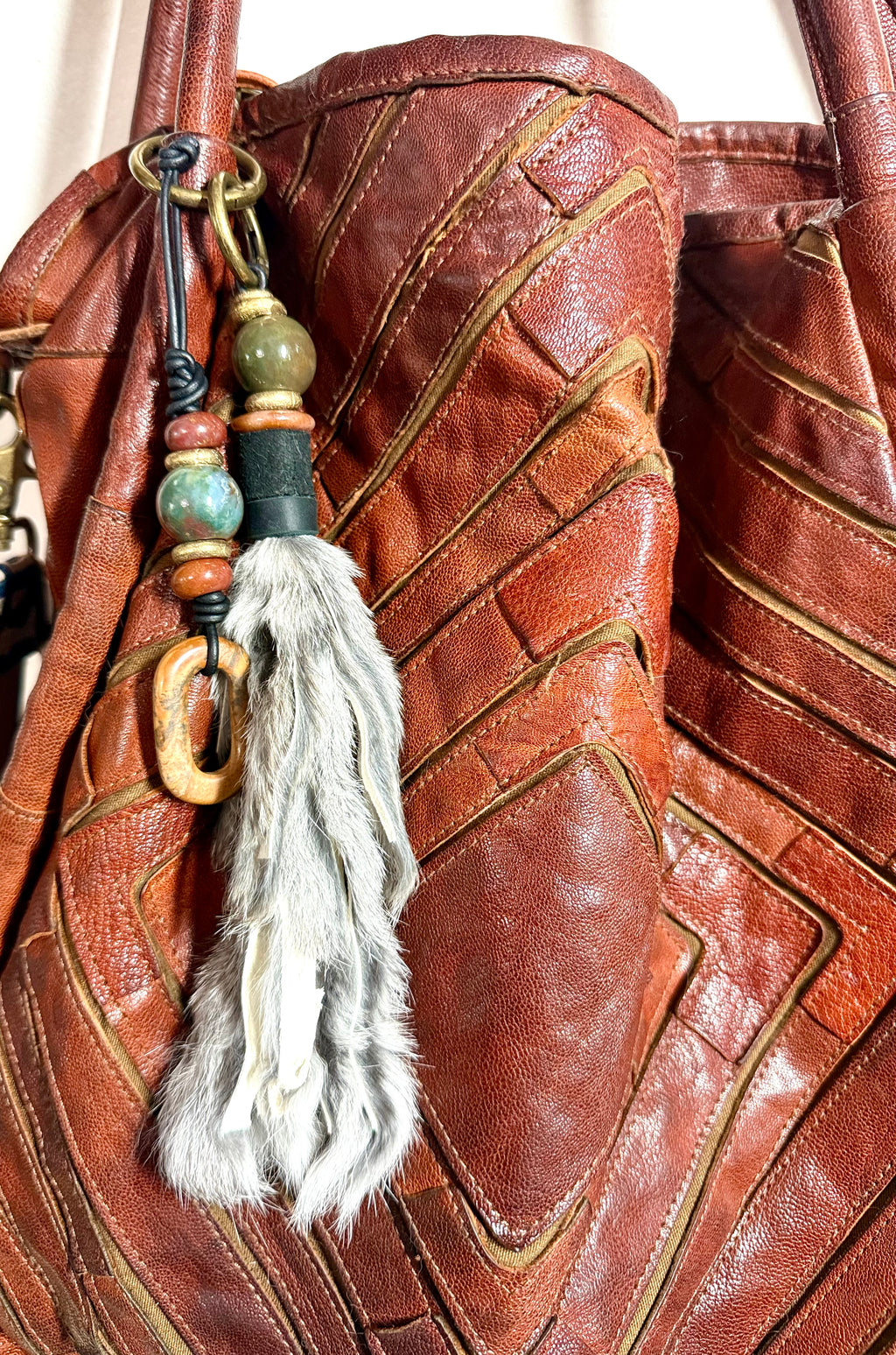 The CURIO Fur Tassel Bag Charm Purse Accessory