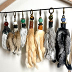 Handcrafted fur bag charm with semiprecious stones and leather detailing by Chasing Sunsets Design.