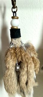 Handcrafted fur bag charm with white quartz stones vintage crystal trim  and leather detailing by Chasing Sunsets Design.