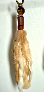 Handcrafted blonde fur bag charm with tigers eye semiprecious stones and leather detailing by Chasing Sunsets Design.