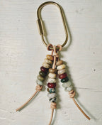 Tan 3 strand charm