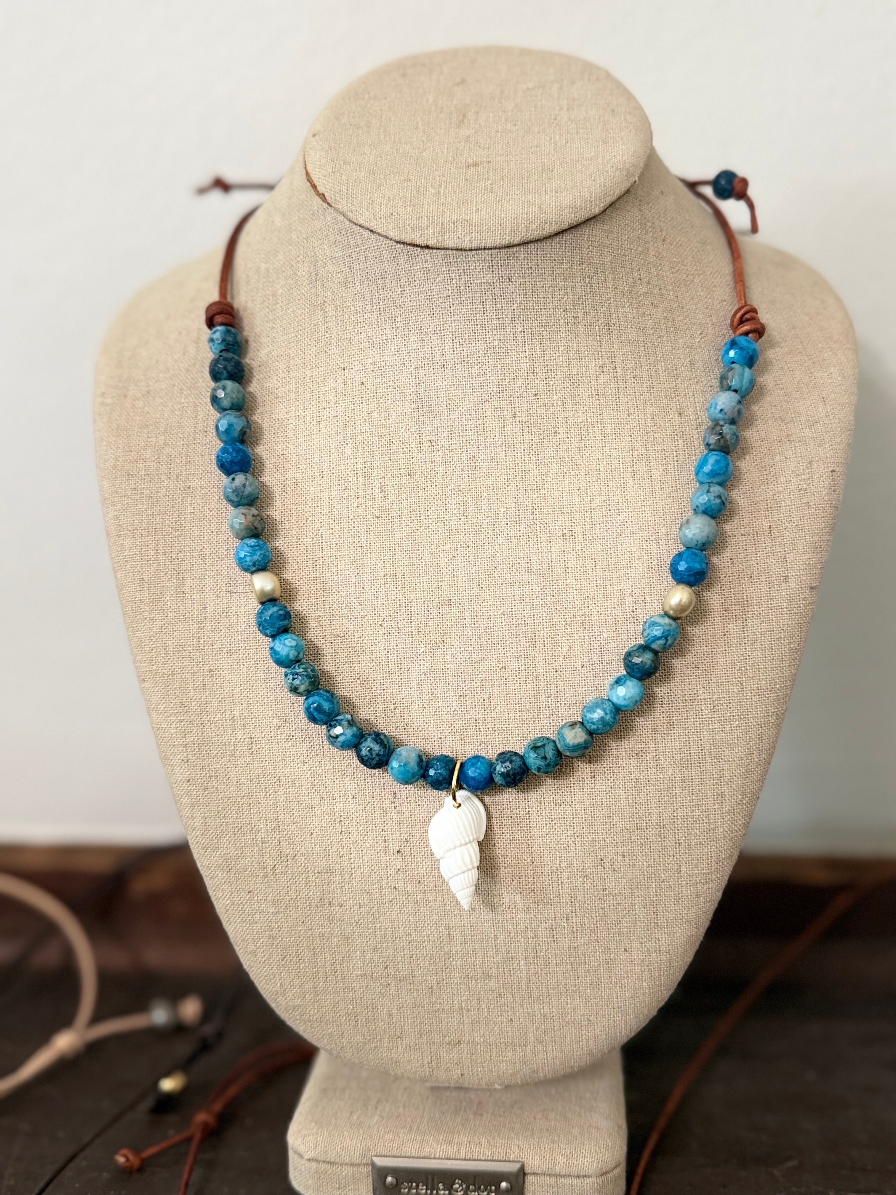 The Sapphire Sea Blue Apatite with freshwater pearl accents White Auger Shell 20 inches